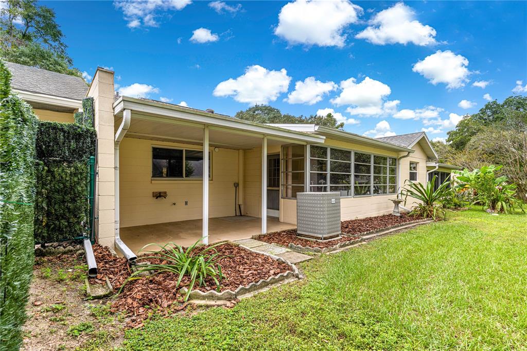 8665 Southwest 94 Street, Unit C Ocala, FL 34481 - Photo 15 of 29 a house view with a garden space
