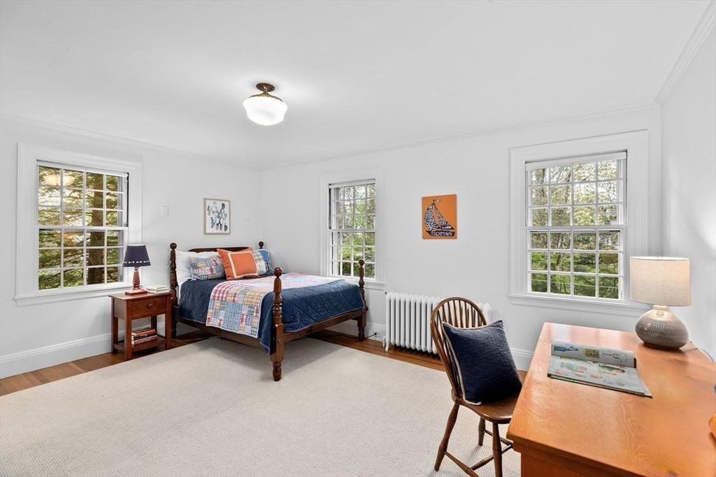 44 Montvale Road Newton, MA 02459 - Photo 19 of 37 a bed room with furniture and a window