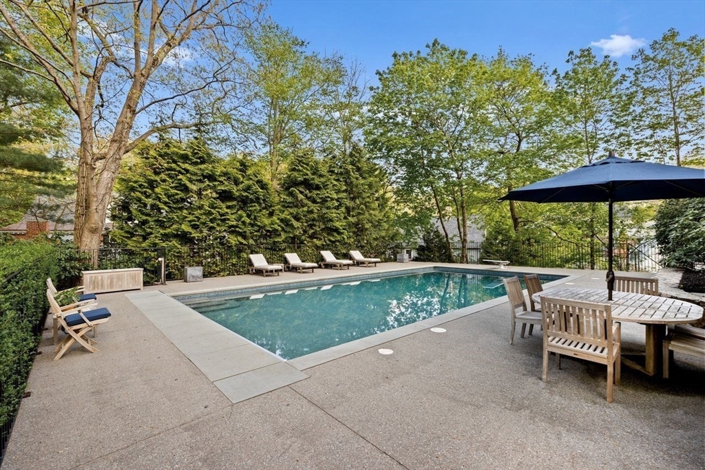 44 Montvale Road Newton, MA 02459 - Photo 32 of 37 a view of backyard with outdoor seating and trees