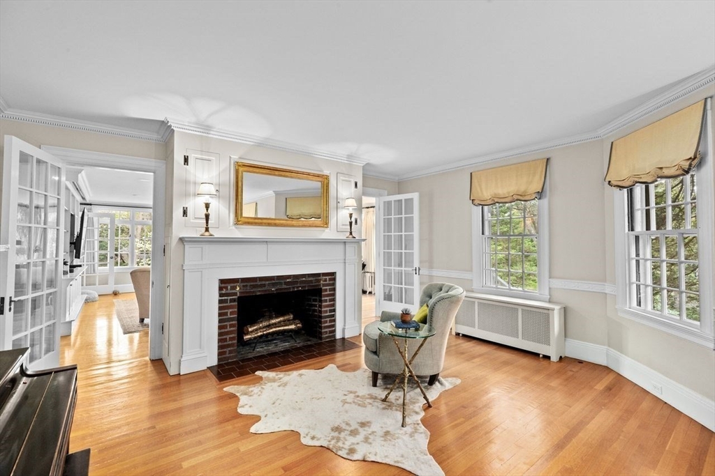 44 Montvale Road Newton, MA 02459 - Photo 10 of 37 a living room with furniture and a fireplace