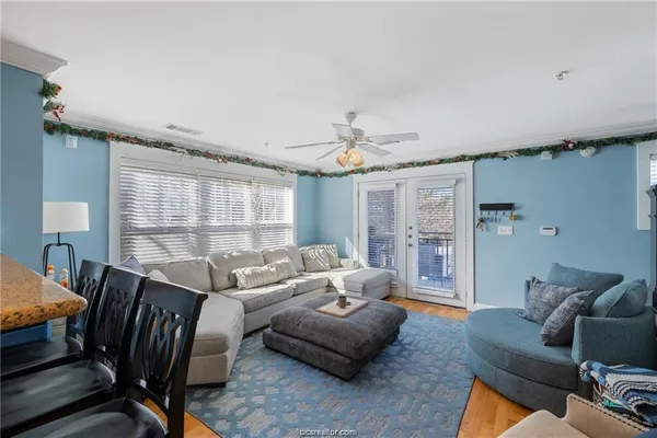 a living room with furniture and a window