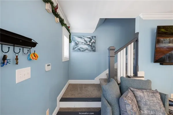 a bedroom with bed and a window