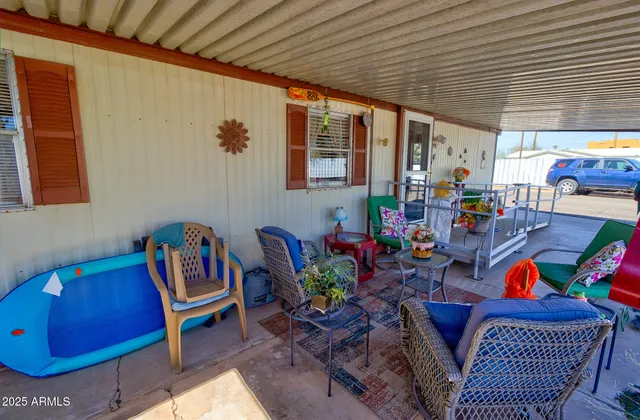 a outdoor living space with furniture and a potted plant