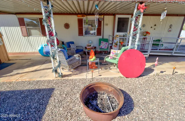 a view of a swimming pool with a patio and a tub