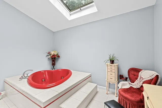 a dining room with furniture a rug and wooden floor