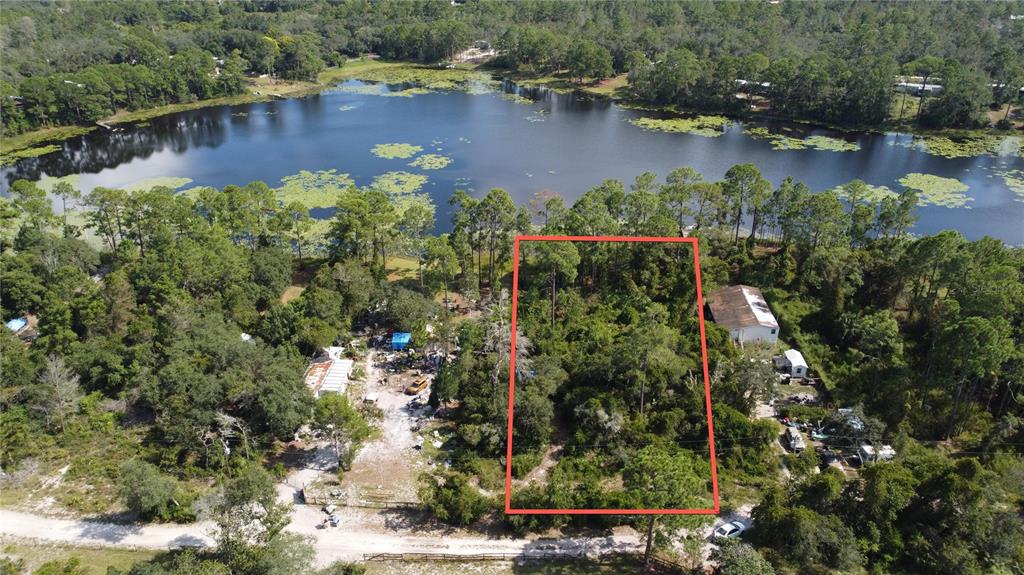 West Lake Road DeLand, FL 32720 - Photo 7 of 8 an aerial view of lake residential house with outdoor space and trees around