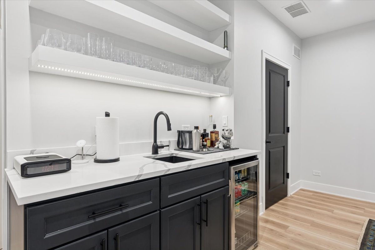 Undisclosed Address Chicago, IL 60630 - Photo 14 of 26 a kitchen with a sink and cabinets