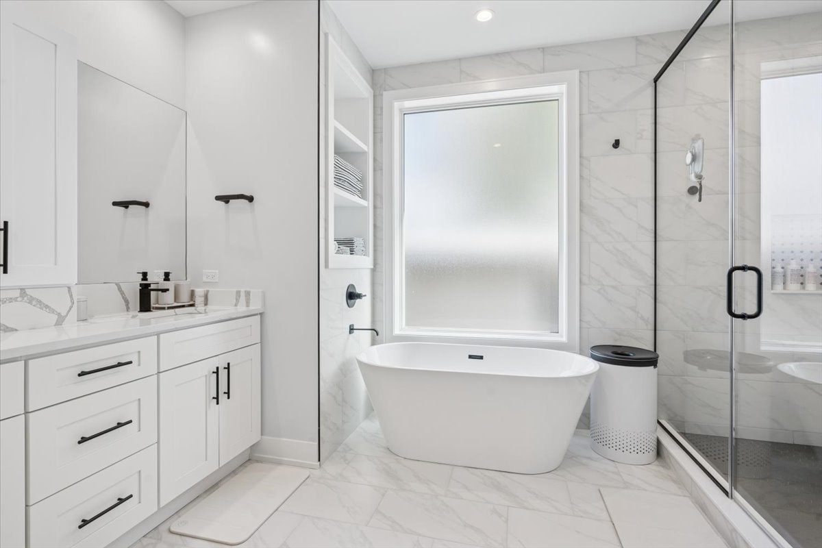 Undisclosed Address Chicago, IL 60630 - Photo 18 of 26 a bathroom with a bathtub and shower