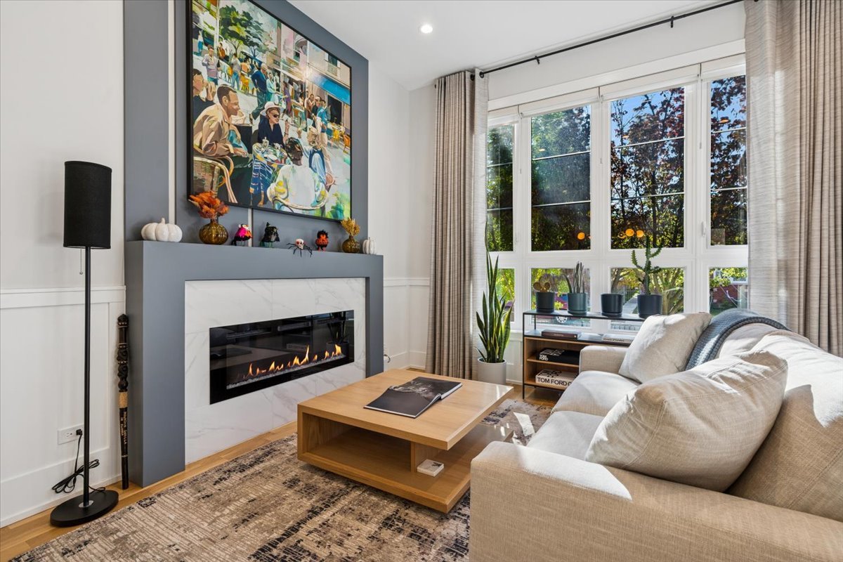 Undisclosed Address Chicago, IL 60630 - Photo 3 of 26 a living room with furniture a fireplace and a flat screen tv