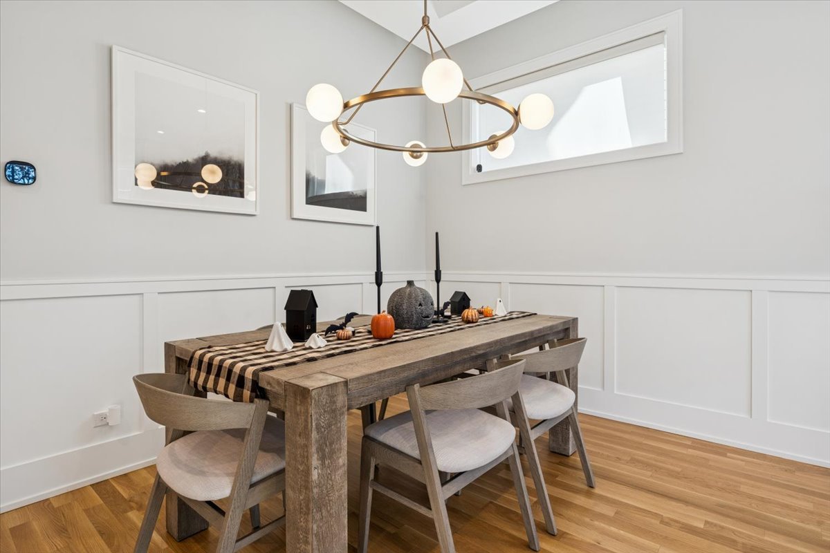 Undisclosed Address Chicago, IL 60630 - Photo 4 of 26 a view of a dining room with furniture and wooden floor