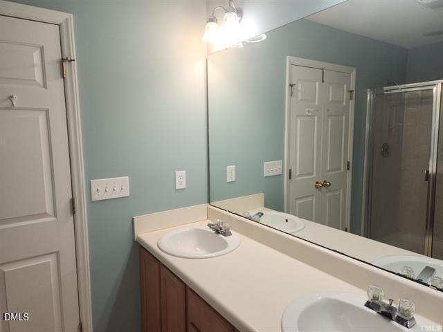 2630 Vega Court Raleigh, NC 27614 - Photo 12 of 17 a bathroom with a sink and a mirror