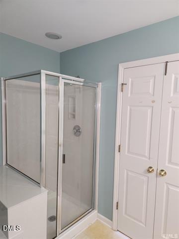 2630 Vega Court Raleigh, NC 27614 - Photo 13 of 17 a bathroom with a shower and a glass door