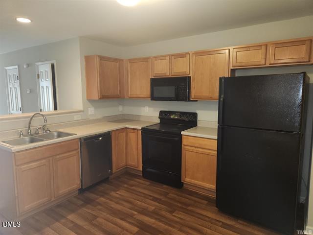 2630 Vega Court Raleigh, NC 27614 - Photo 2 of 17 a kitchen with a refrigerator stove and sink