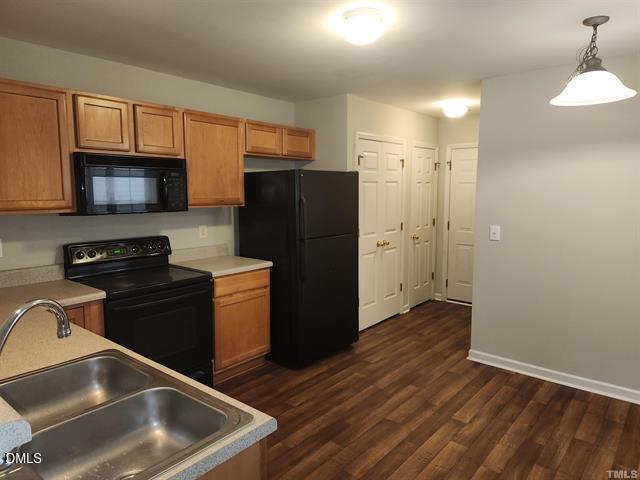 2630 Vega Court Raleigh, NC 27614 - Photo 6 of 17 a kitchen with a refrigerator stove and a sink