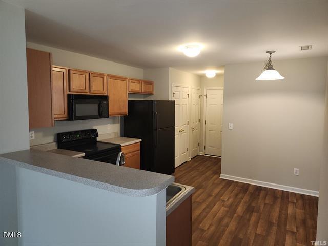 2630 Vega Court Raleigh, NC 27614 - Photo 7 of 17 a kitchen with stainless steel appliances a refrigerator and a stove top oven