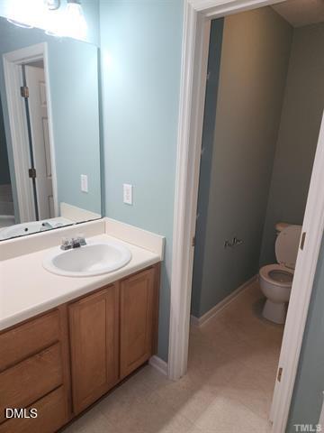 2630 Vega Court Raleigh, NC 27614 - Photo 10 of 17 a bathroom with a sink and a toilet
