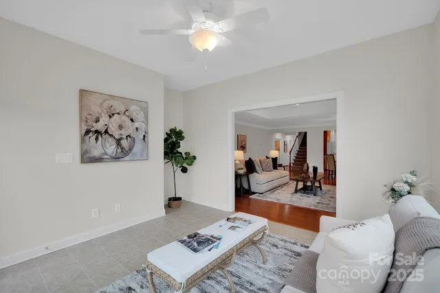 a living room with furniture and next to a window