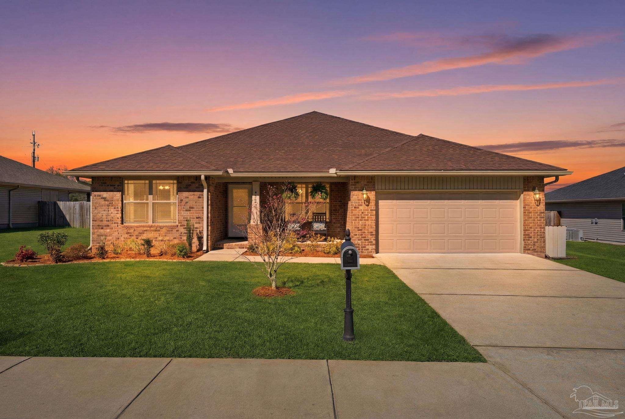 a front view of a house with a garden and porch