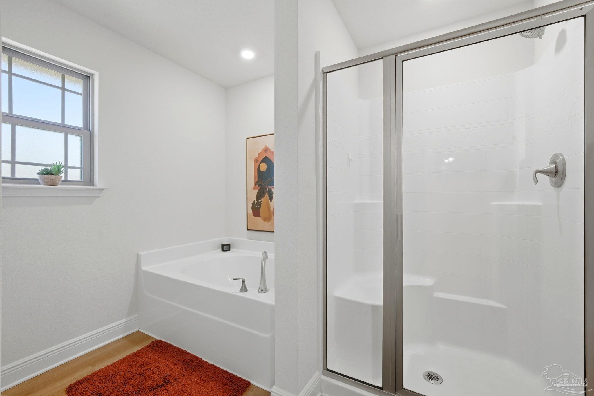 6022 Willsey Trail Crestview, FL 32539 - Photo 21 of 33 a bathroom with a bathtub and a shower