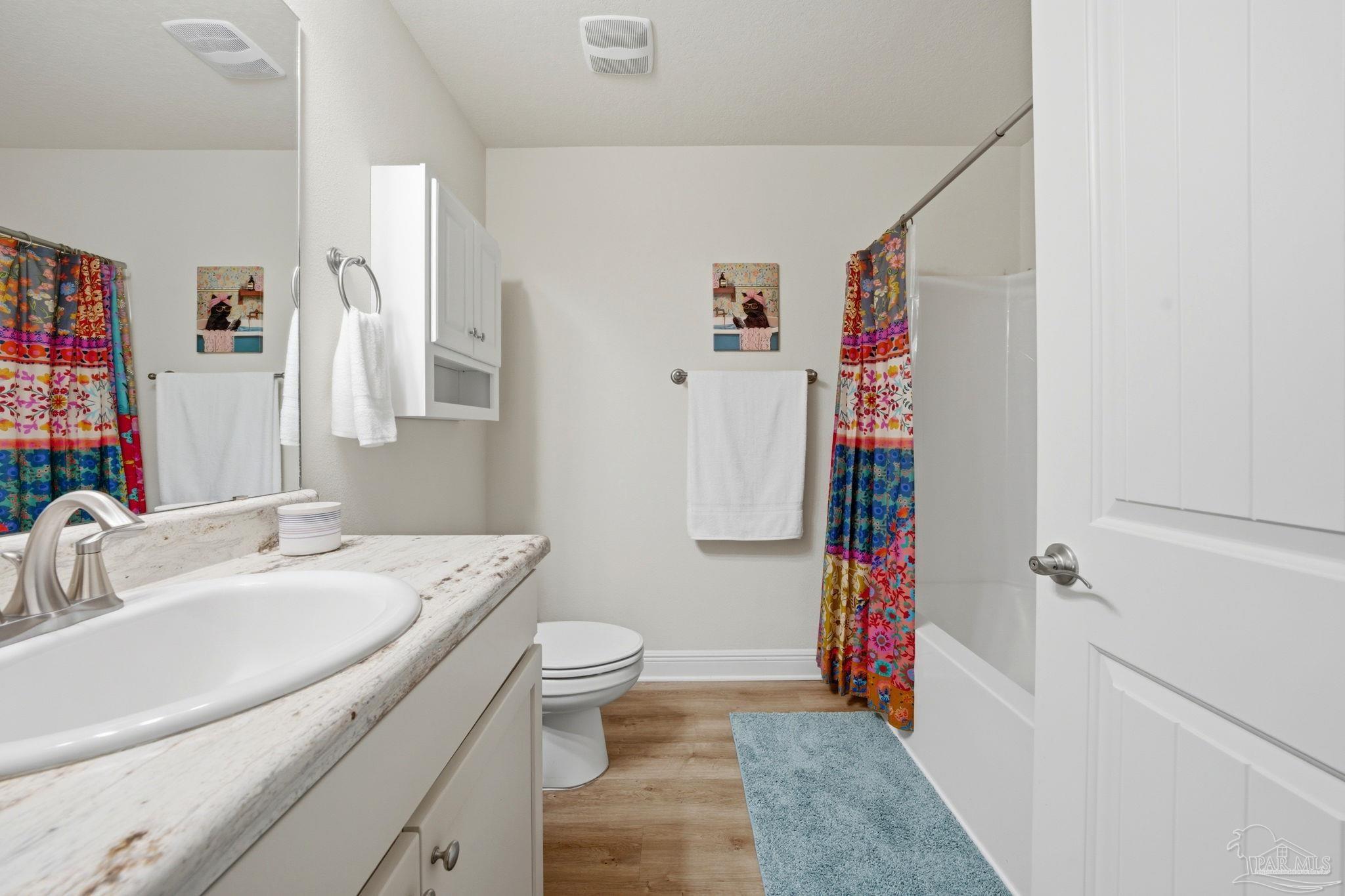 6022 Willsey Trail Crestview, FL 32539 - Photo 24 of 33 a bathroom with a sink toilet and shower
