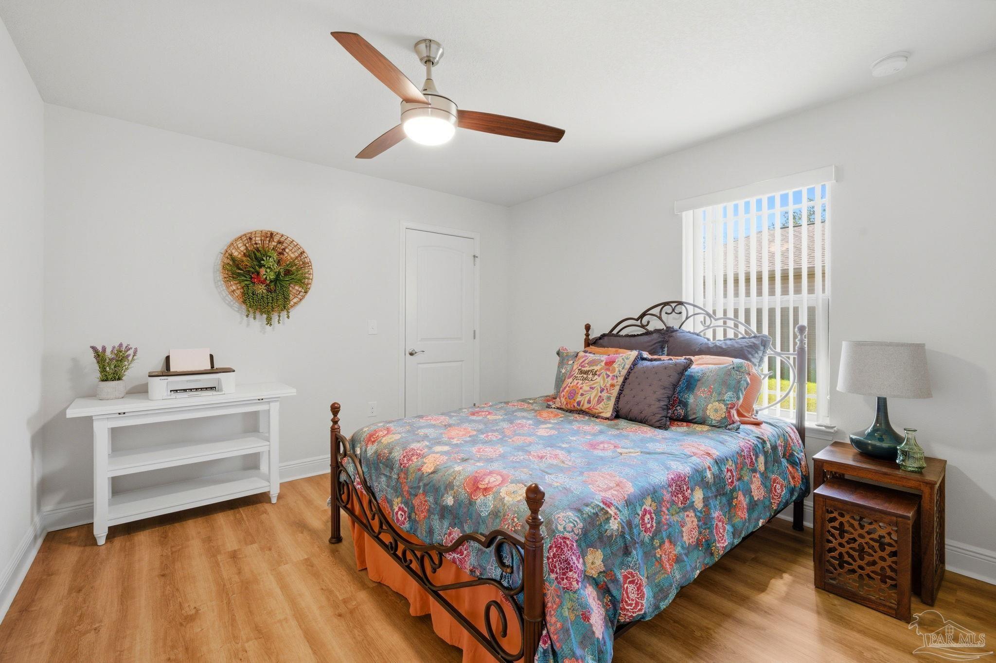 6022 Willsey Trail Crestview, FL 32539 - Photo 25 of 33 a bedroom with a bed and a desk