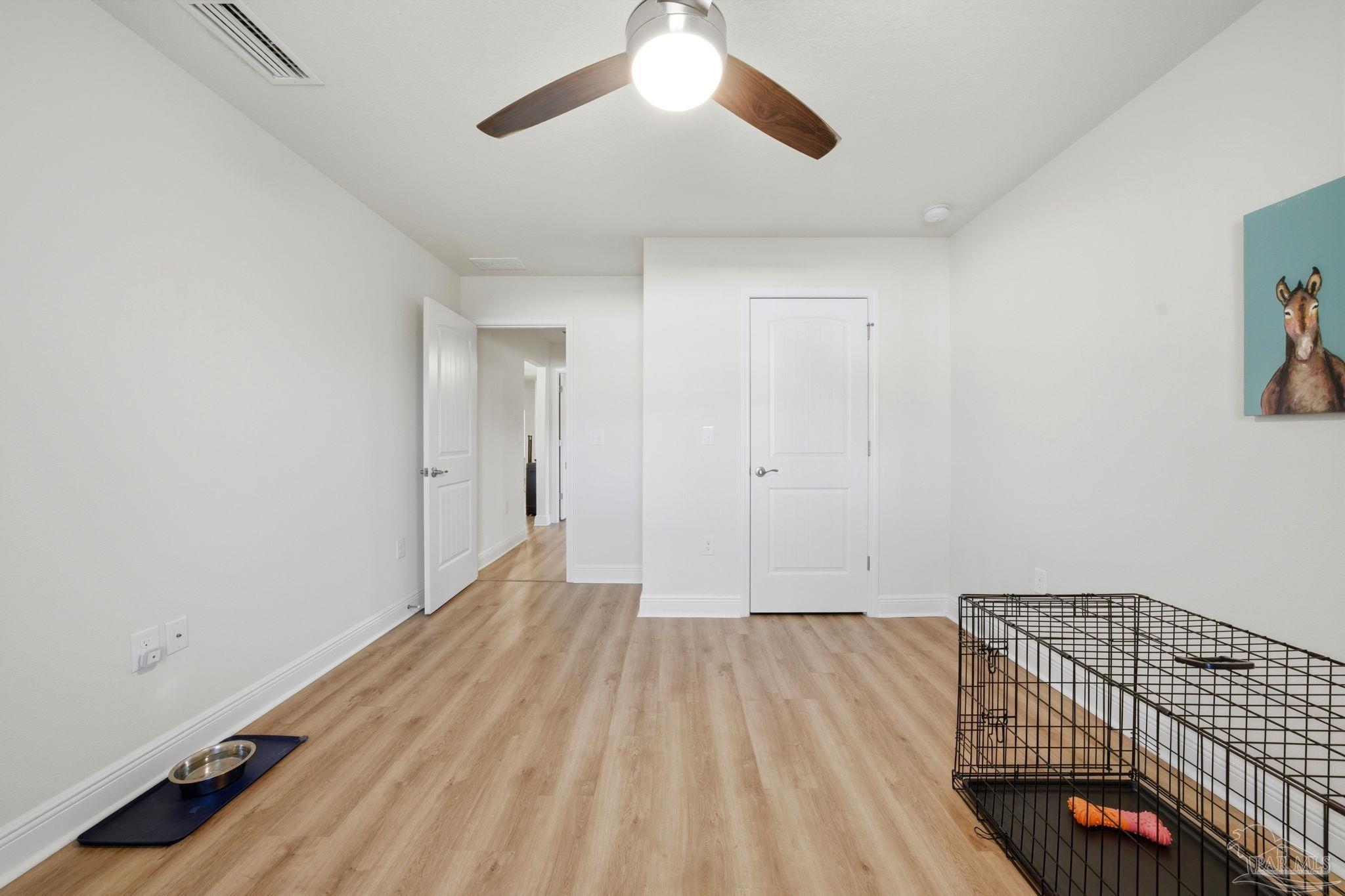 6022 Willsey Trail Crestview, FL 32539 - Photo 31 of 33 a view of room with wooden floor and fan