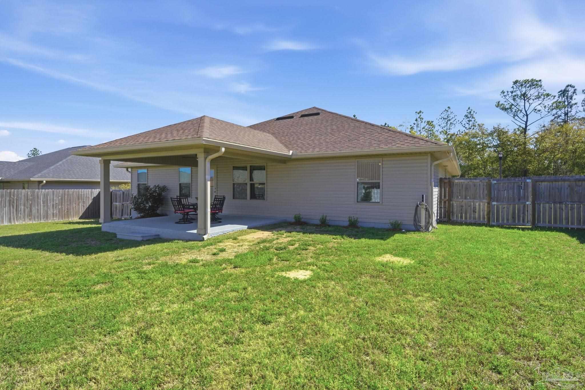6022 Willsey Trail Crestview, FL 32539 - Photo 32 of 33 a view of a house with backyard porch and garden
