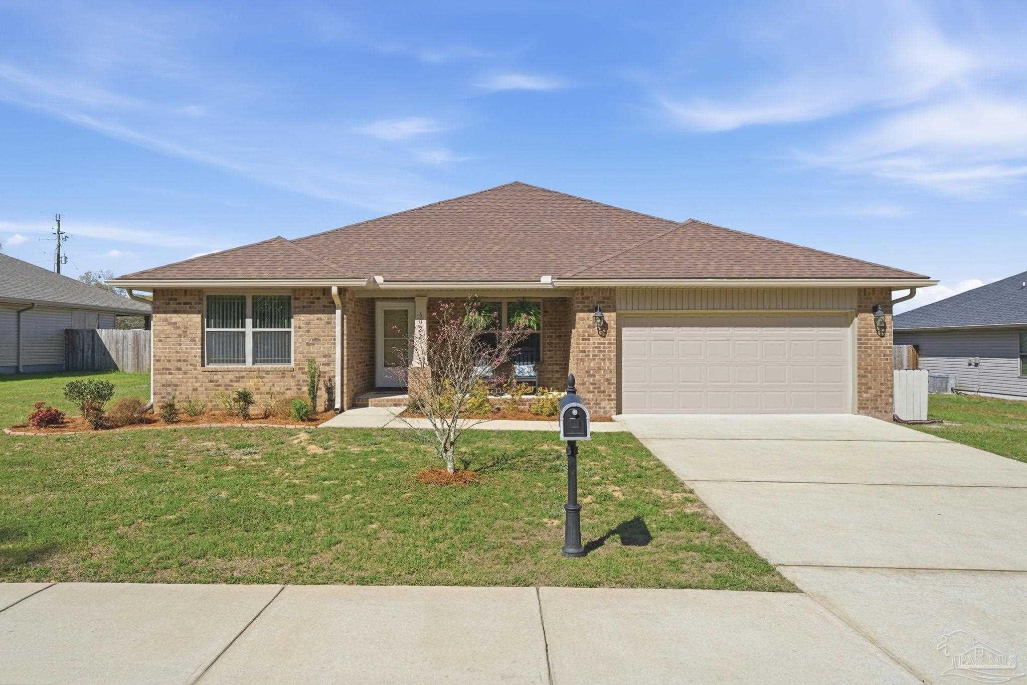 6022 Willsey Trail Crestview, FL 32539 - Photo 4 of 33 a front view of a house with a yard and porch