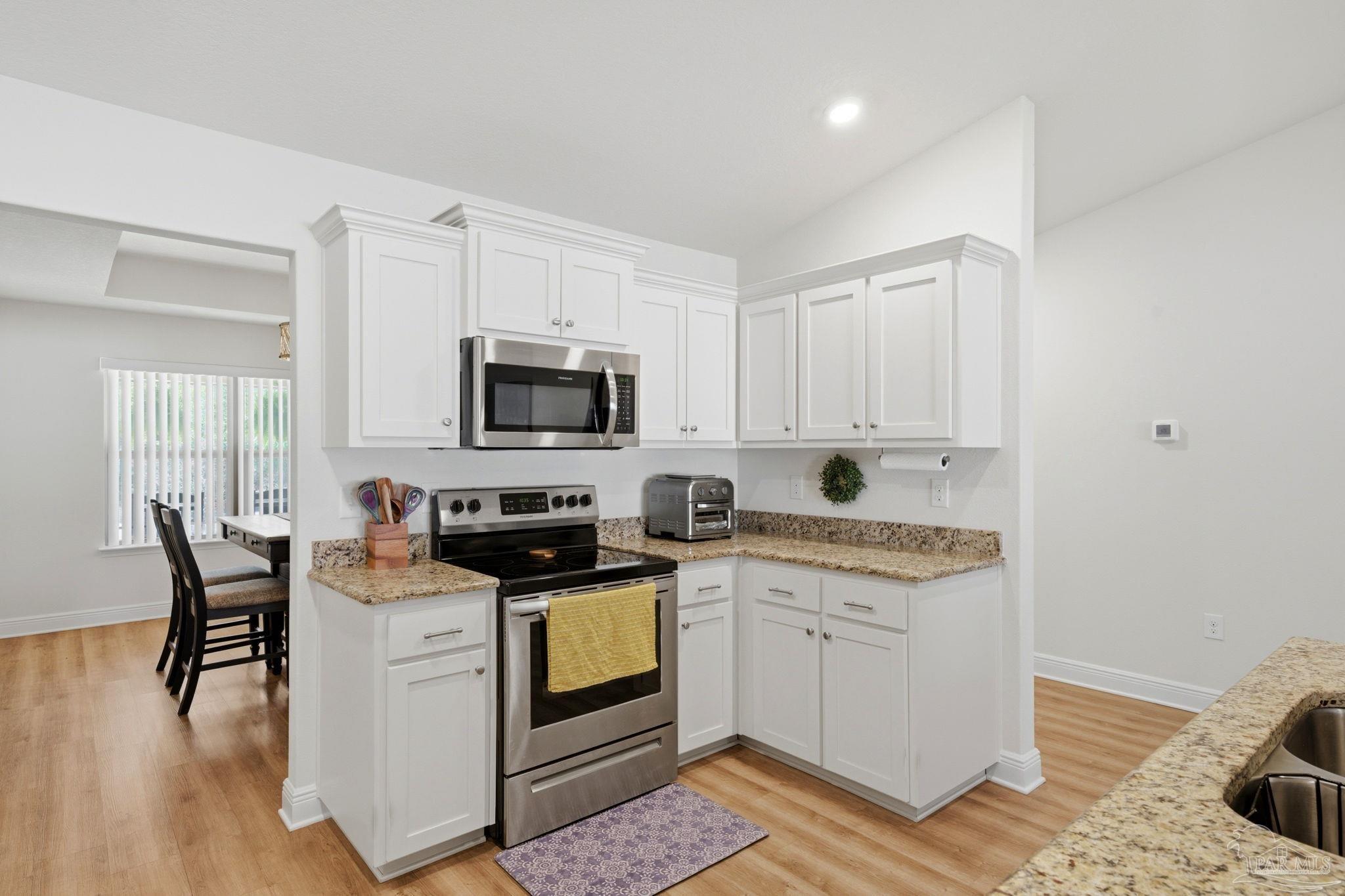 6022 Willsey Trail Crestview, FL 32539 - Photo 8 of 33 a kitchen with appliances a sink and cabinets