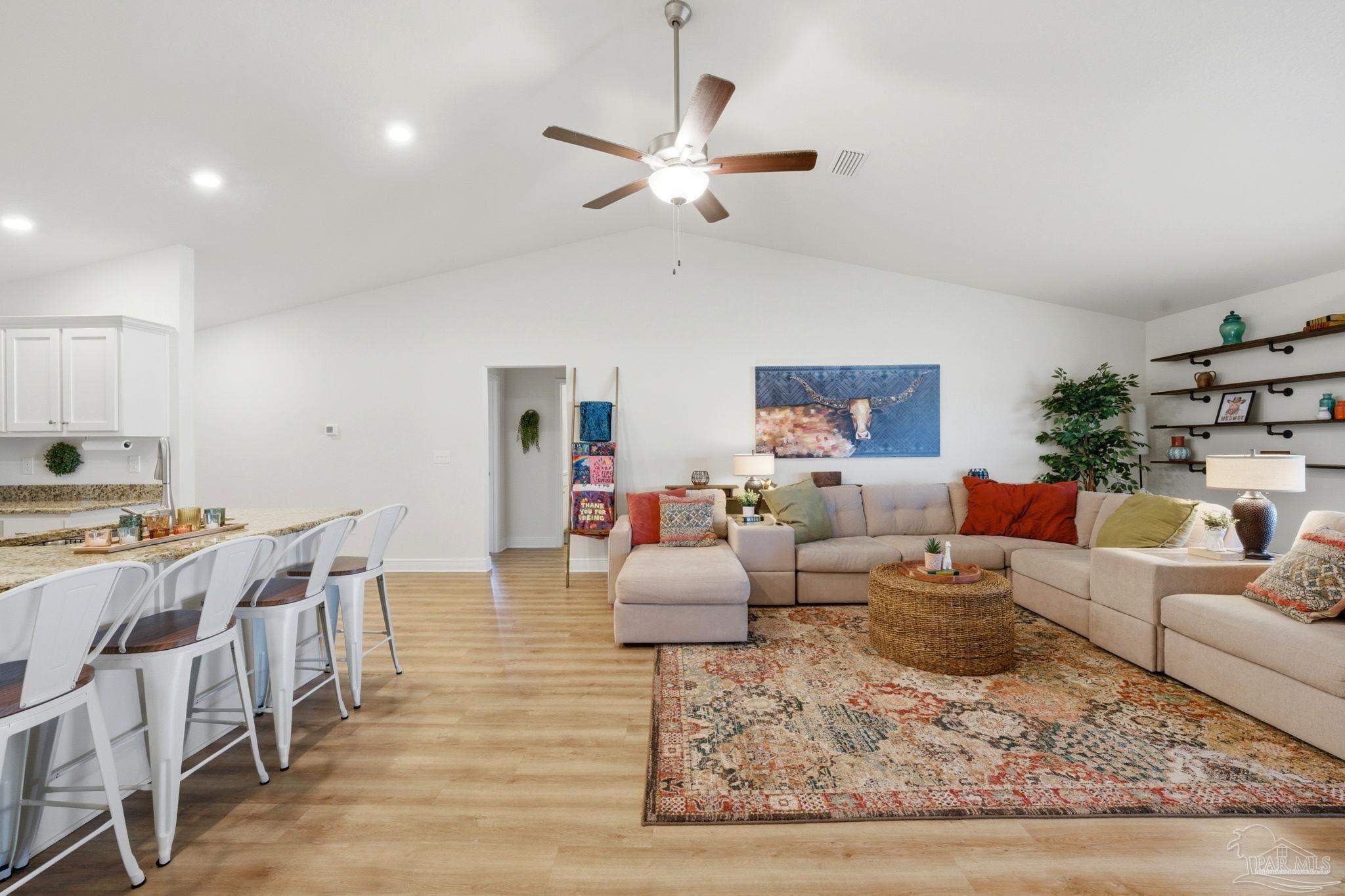6022 Willsey Trail Crestview, FL 32539 - Photo 10 of 33 a living room with furniture and wooden floor