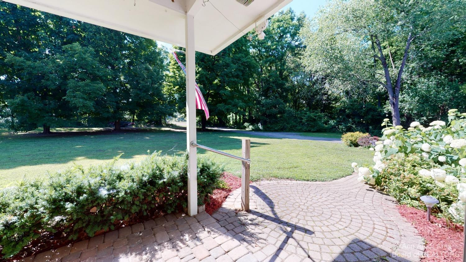 7391 Bush Road Chelsea, MI 48118 - Photo 2 of 38 Paver Entrance - Perennial Gardens