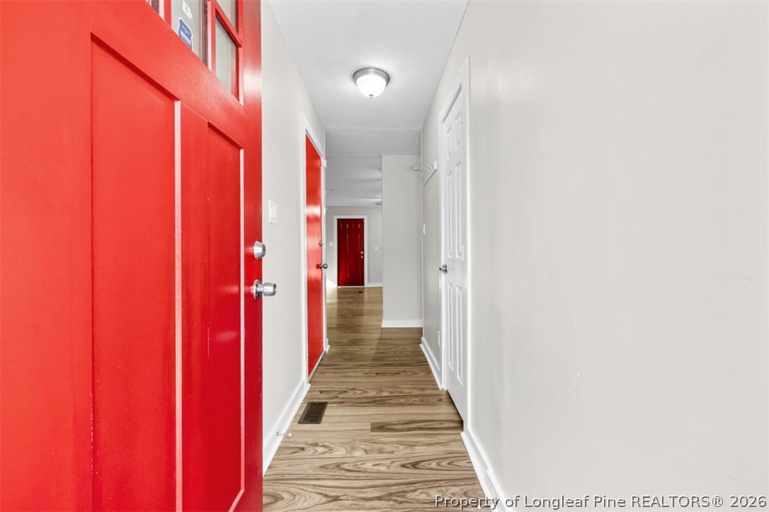 3305 Hunting Bay Drive Spring Lake, NC 28390 - Photo 7 of 27 a view of a hallway with wooden floor