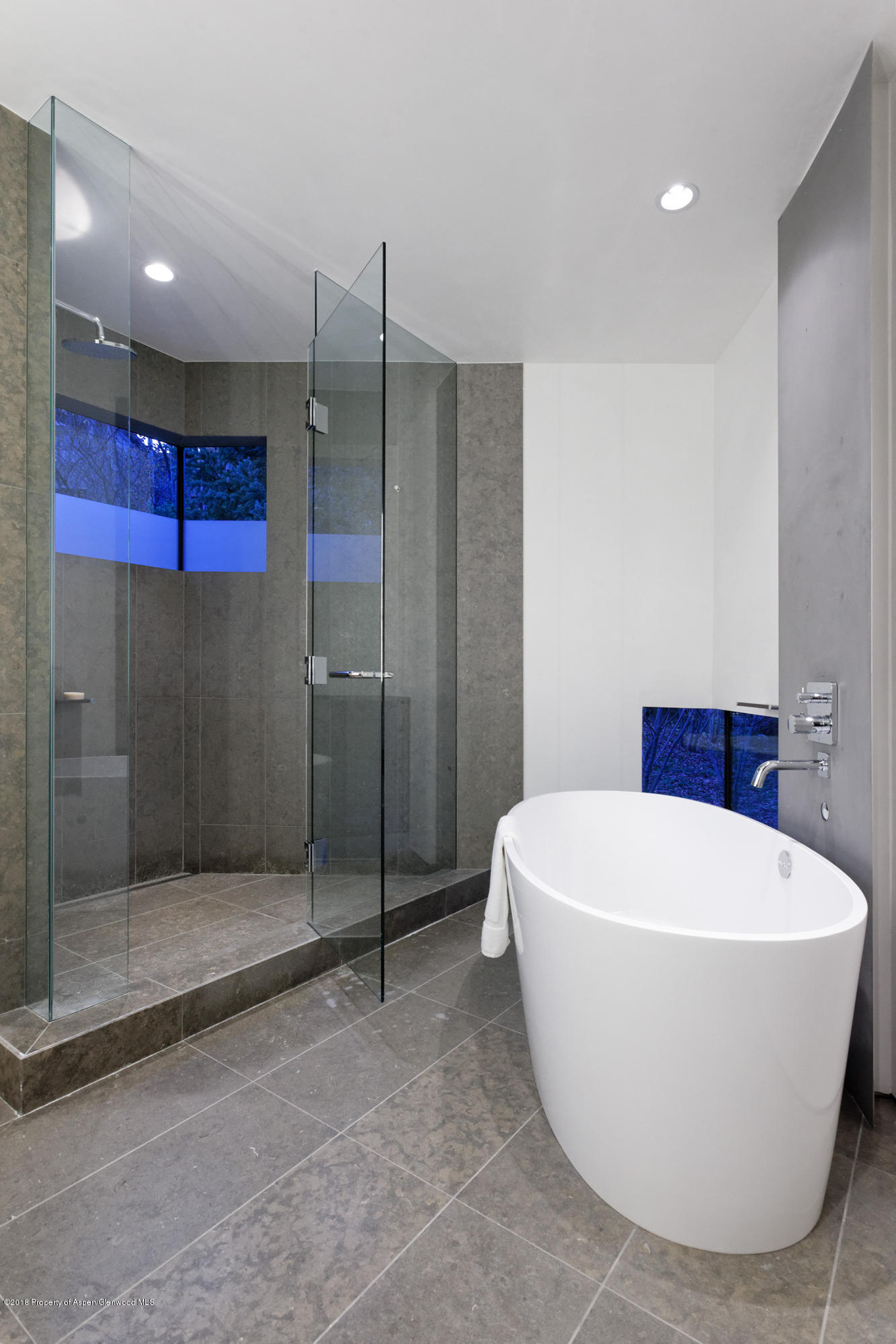 1118 Waters Avenue Aspen, CO 81611 - Photo 14 of 30 a white bath tub sitting in a bathroom