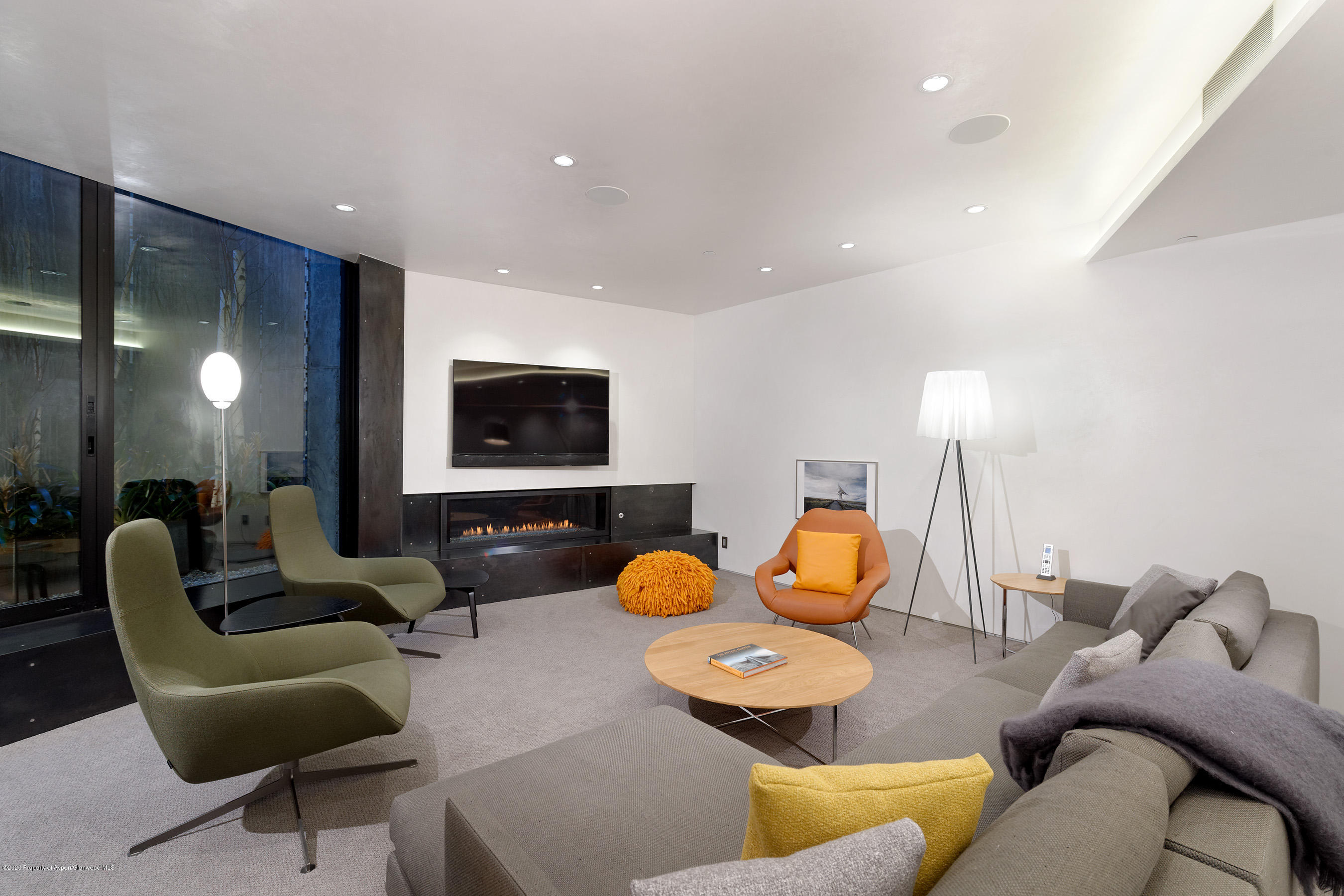 1118 Waters Avenue Aspen, CO 81611 - Photo 29 of 30 a living room with furniture and a flat screen tv