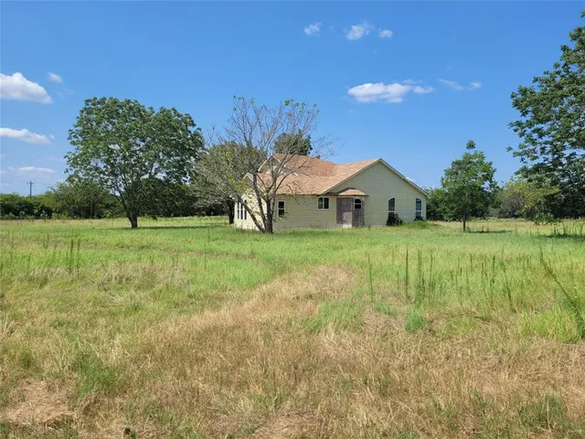 a house view with garden space