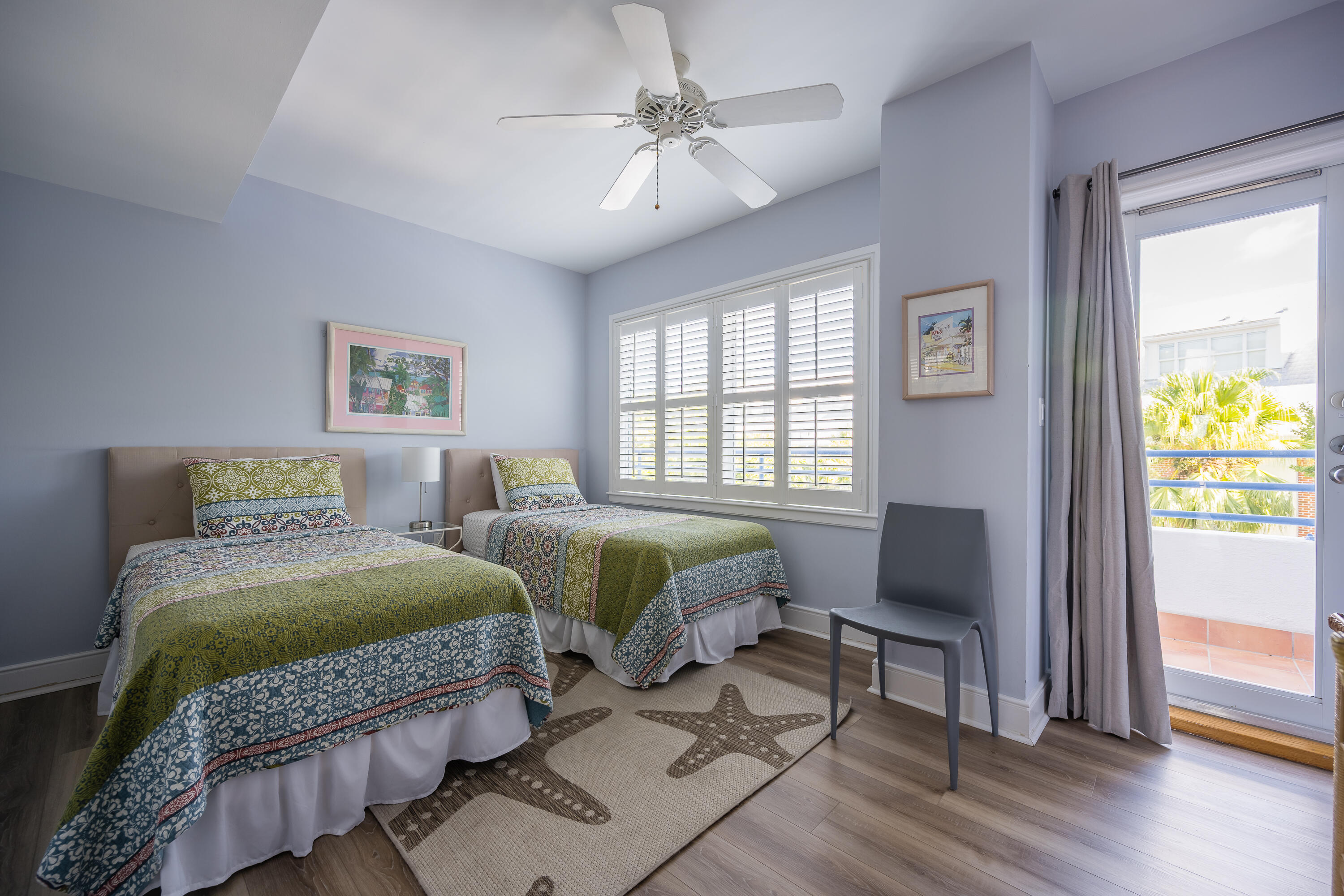 105 Front Street, Unit 119 Key West, FL 33040 - Photo 11 of 18 a bedroom with two beds and a window