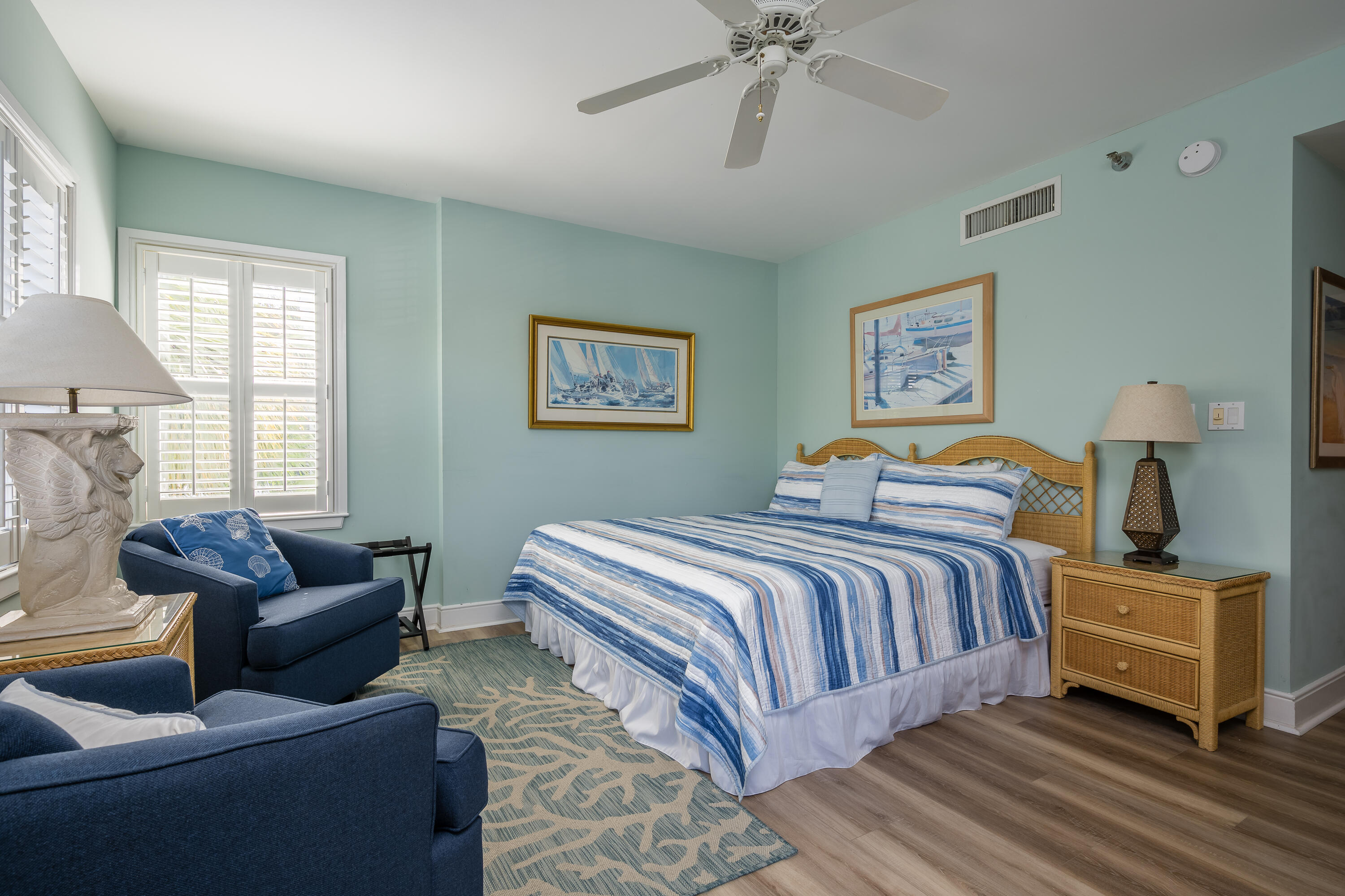 105 Front Street, Unit 119 Key West, FL 33040 - Photo 13 of 18 a bedroom with bed couch and window