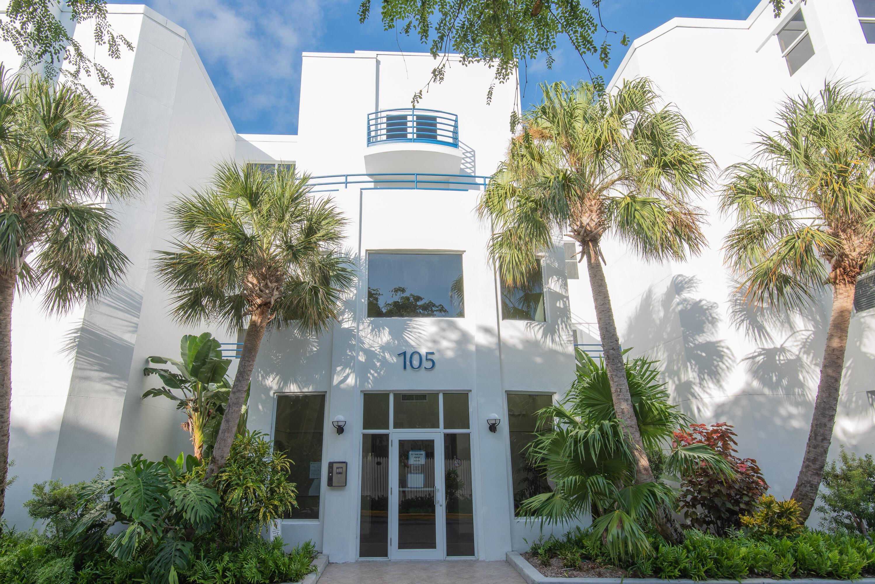105 Front Street, Unit 119 Key West, FL 33040 - Photo 16 of 18 a front view of house with yard and green space