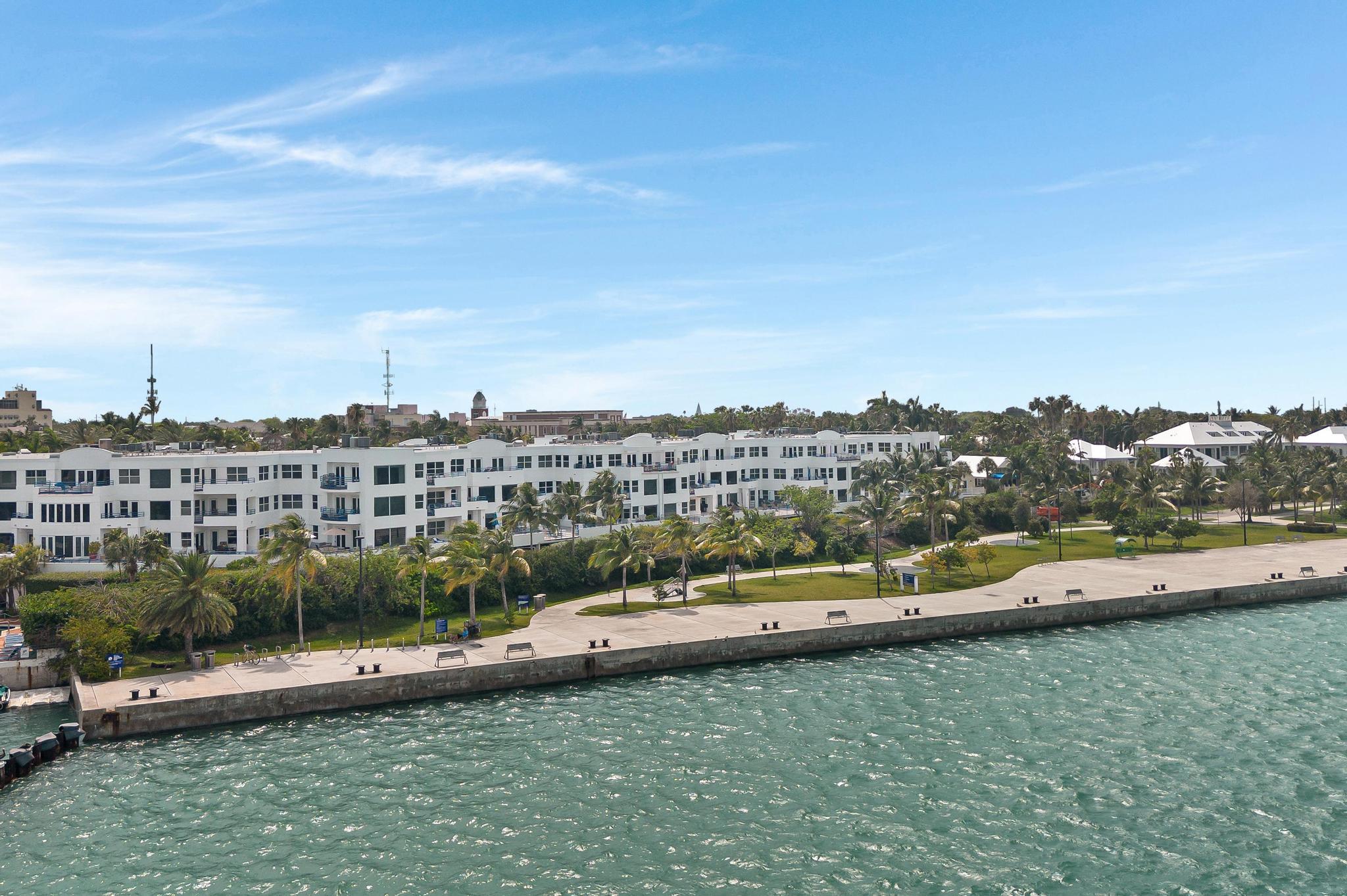 105 Front Street, Unit 119 Key West, FL 33040 - Photo 18 of 18 a view of a city with lawn chairs
