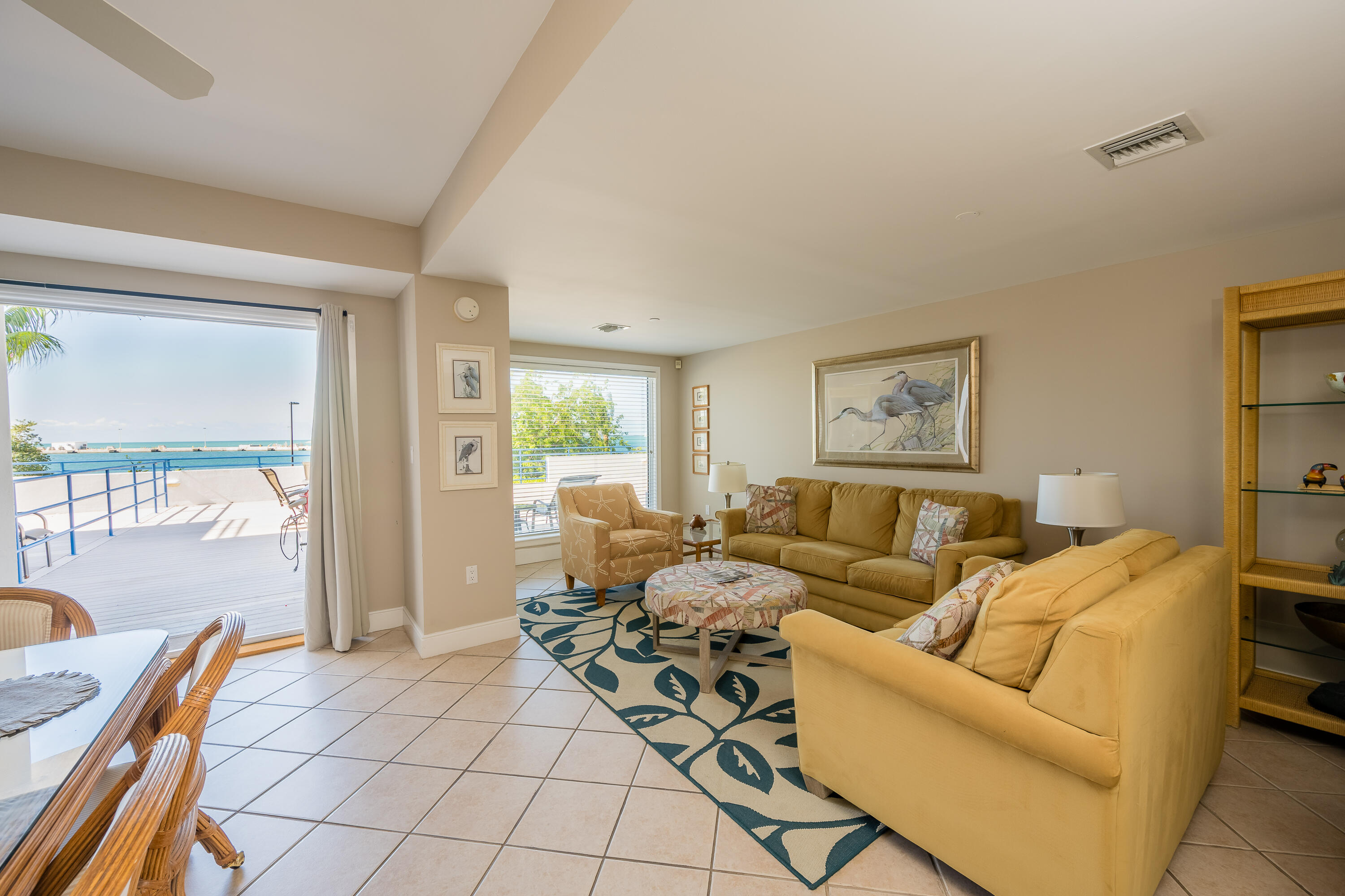 105 Front Street, Unit 119 Key West, FL 33040 - Photo 2 of 18 a living room with furniture and a large window