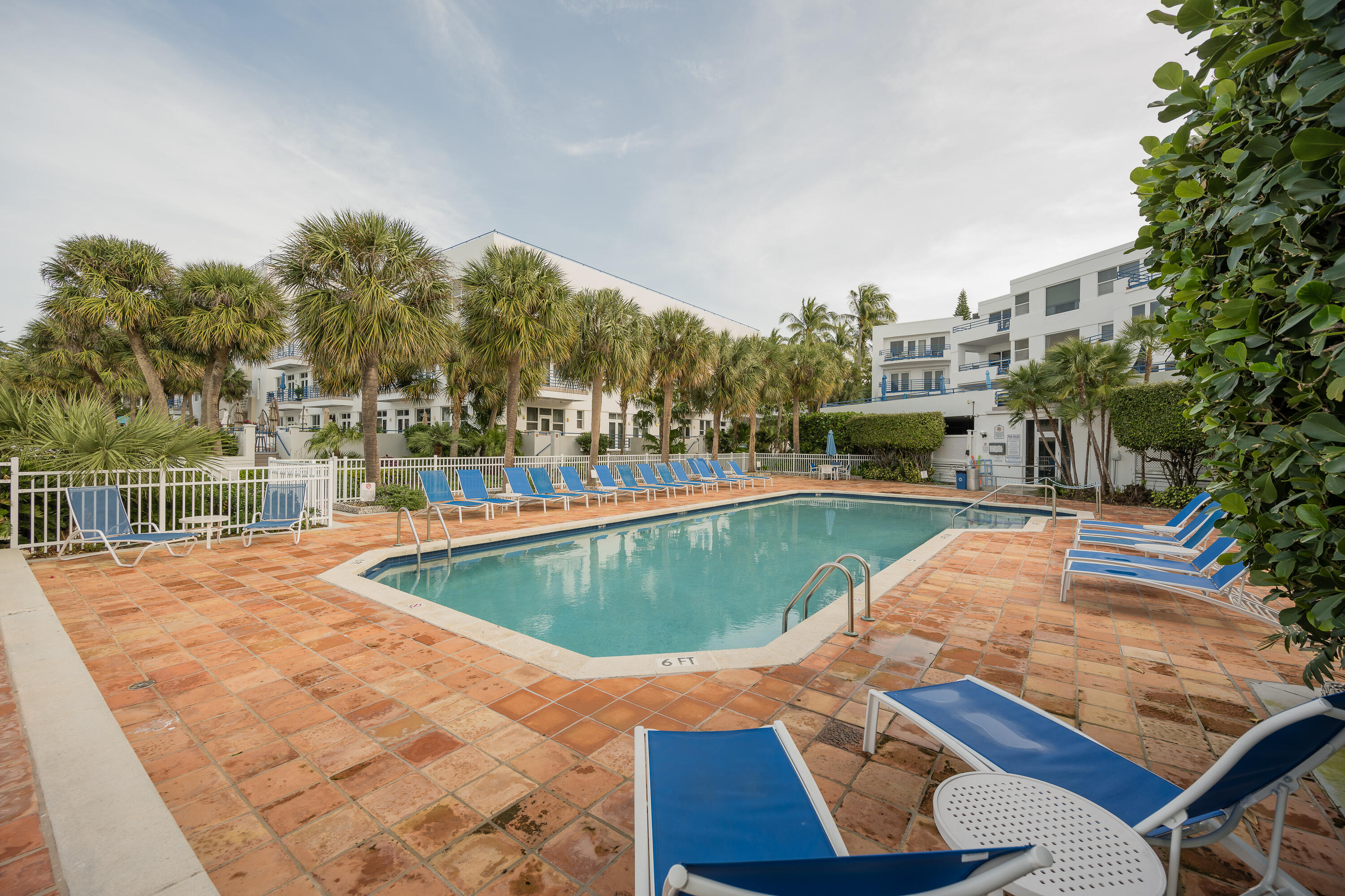 105 Front Street, Unit 119 Key West, FL 33040 - Photo 7 of 18 a view of a swimming pool with a yard