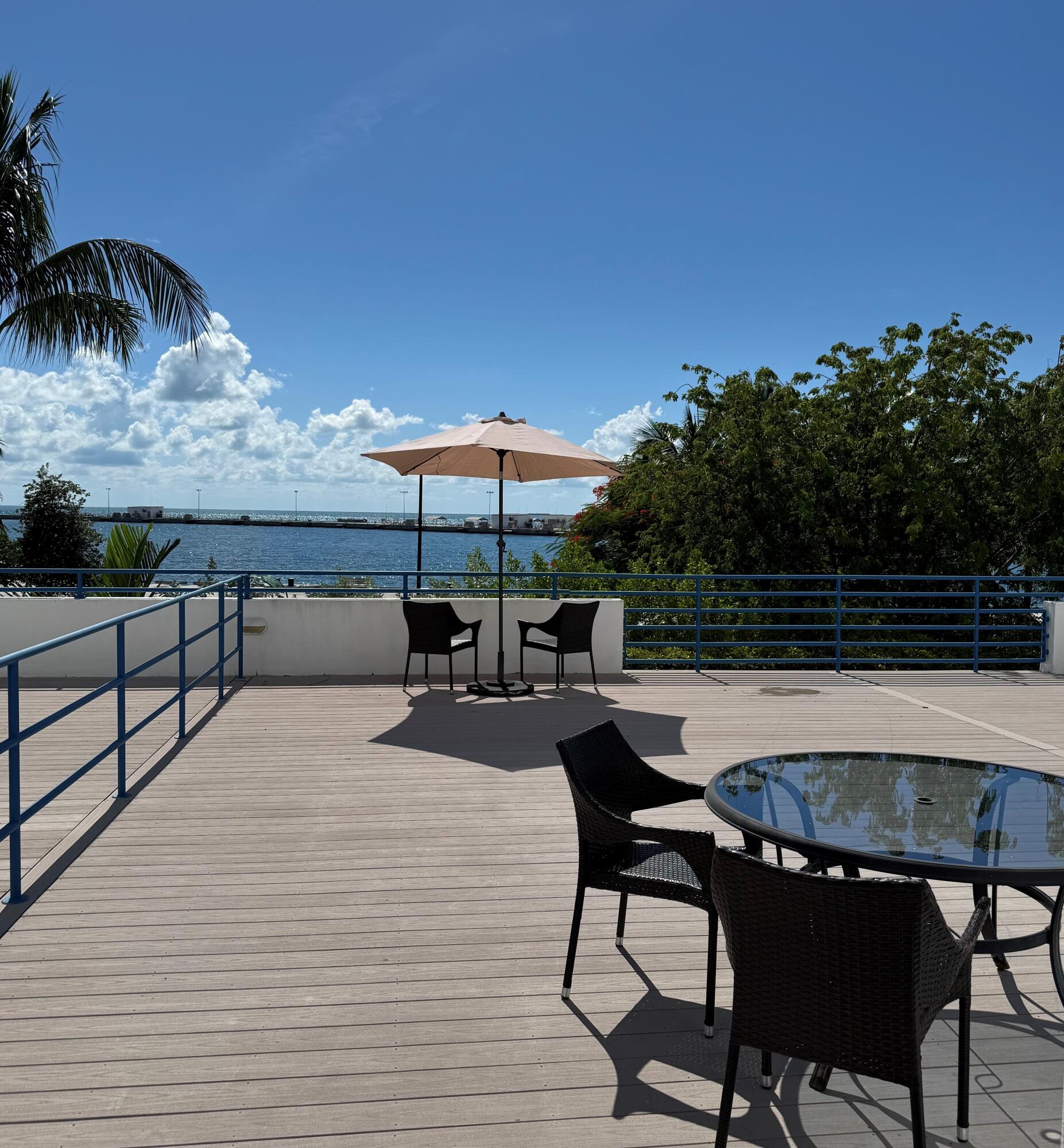 105 Front Street, Unit 119 Key West, FL 33040 - Photo 8 of 18 a patio with table and chairs