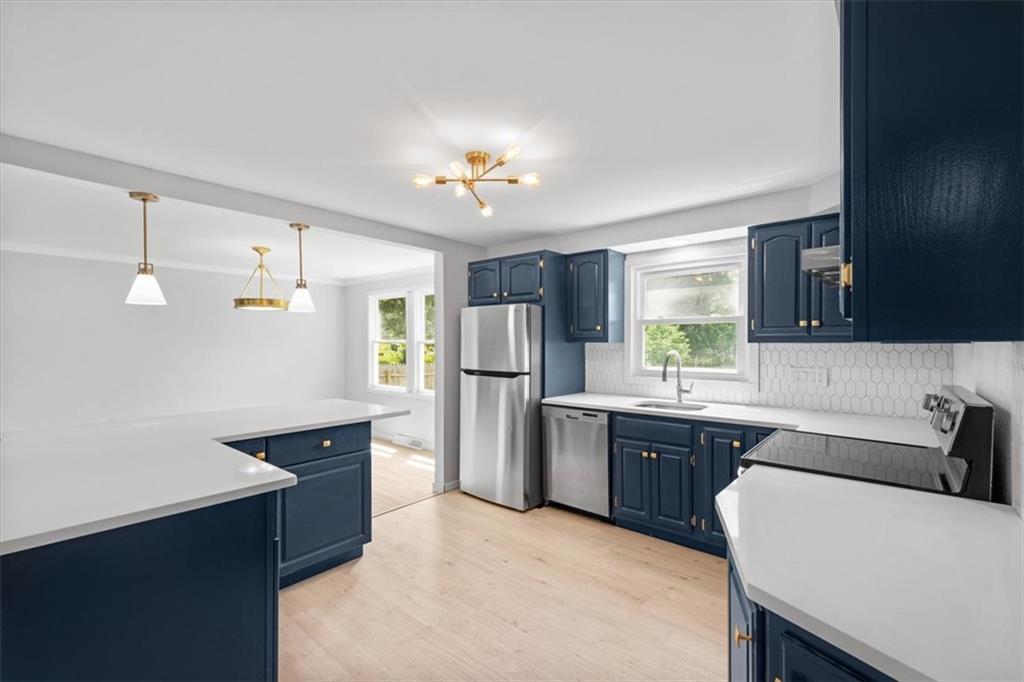 457 Inwood Road Pittsburgh, PA 15237 - Photo 14 of 39 a kitchen with refrigerator cabinets and furniture