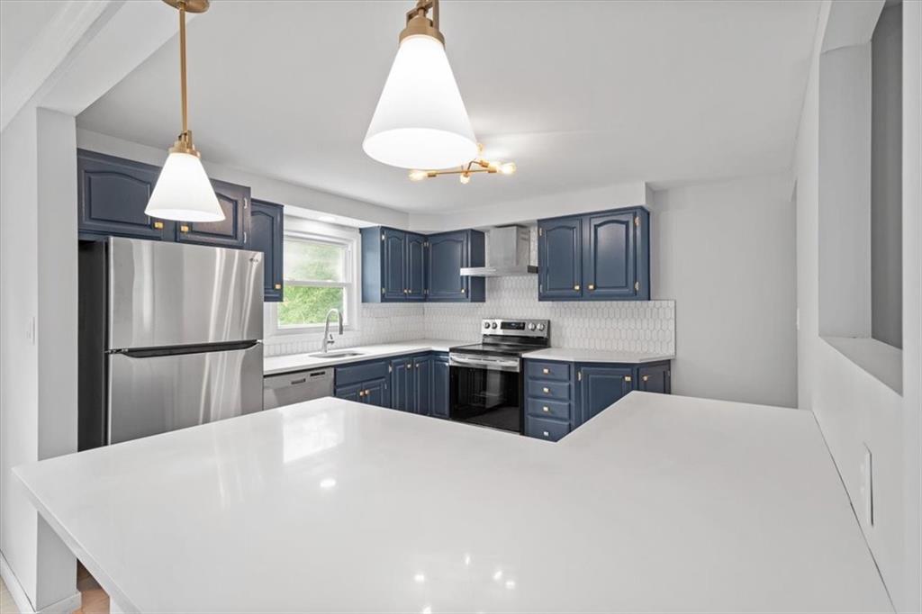 457 Inwood Road Pittsburgh, PA 15237 - Photo 15 of 39 a kitchen with a refrigerator a sink and a stove