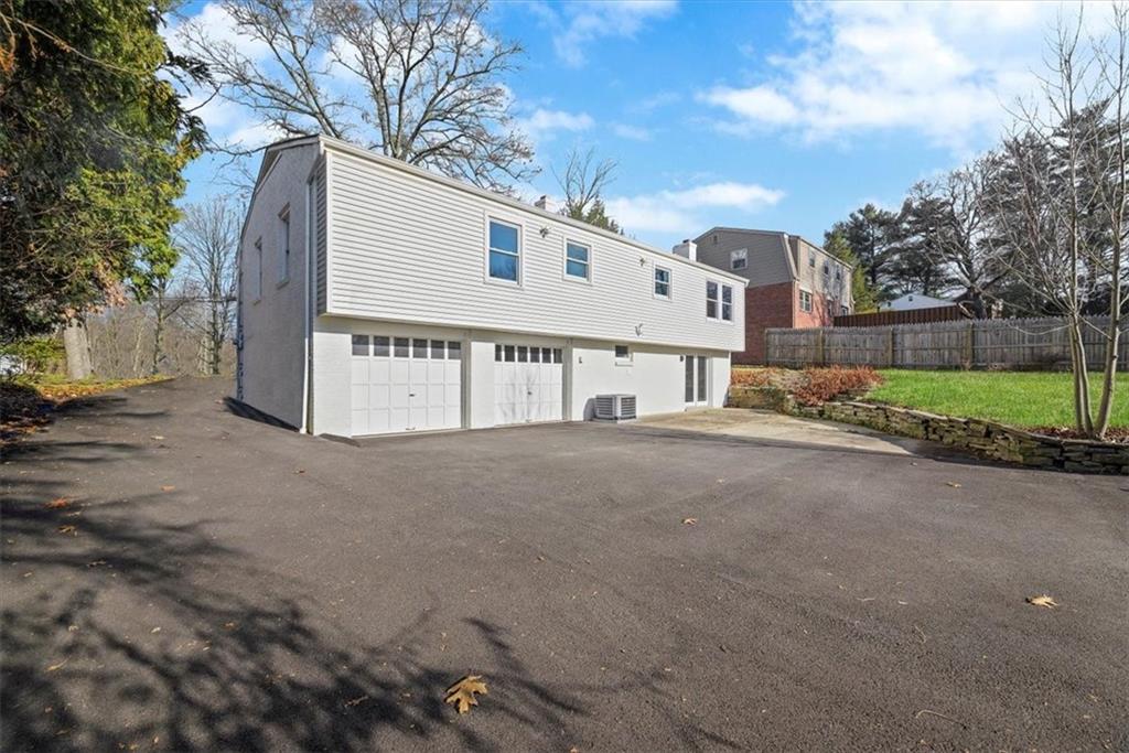 457 Inwood Road Pittsburgh, PA 15237 - Photo 2 of 39 a view of a house with a yard and garage
