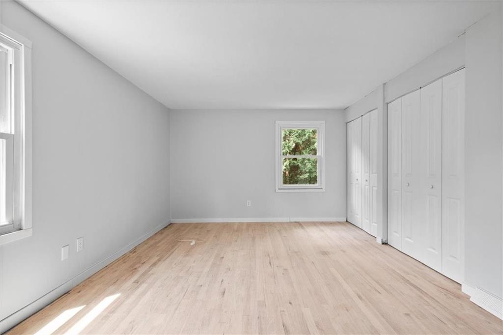 457 Inwood Road Pittsburgh, PA 15237 - Photo 29 of 39 an empty room with wooden floor and windows