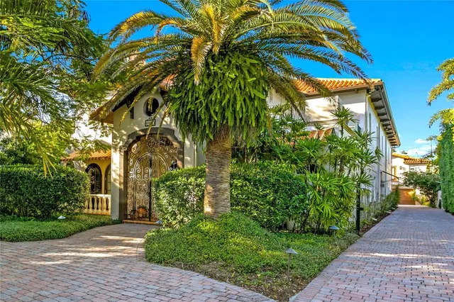 a living room with fireplace furniture and a chandelier