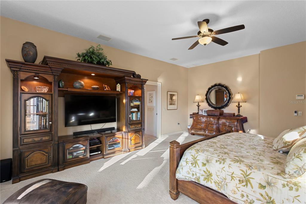 4803 West Woodmere Road Tampa, FL 33609 - Photo 38 of 80 a bedroom with furniture and a flat screen tv