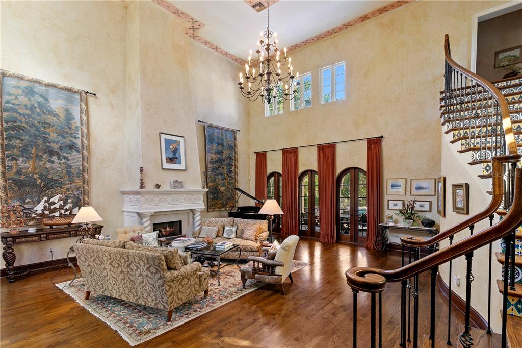 4803 West Woodmere Road Tampa, FL 33609 - Photo 5 of 80 a living room with fireplace furniture and a chandelier