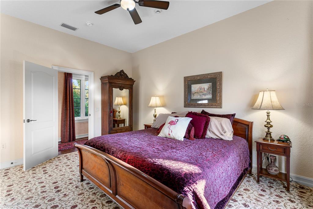 4803 West Woodmere Road Tampa, FL 33609 - Photo 51 of 80 a bedroom with a bed and wooden floor